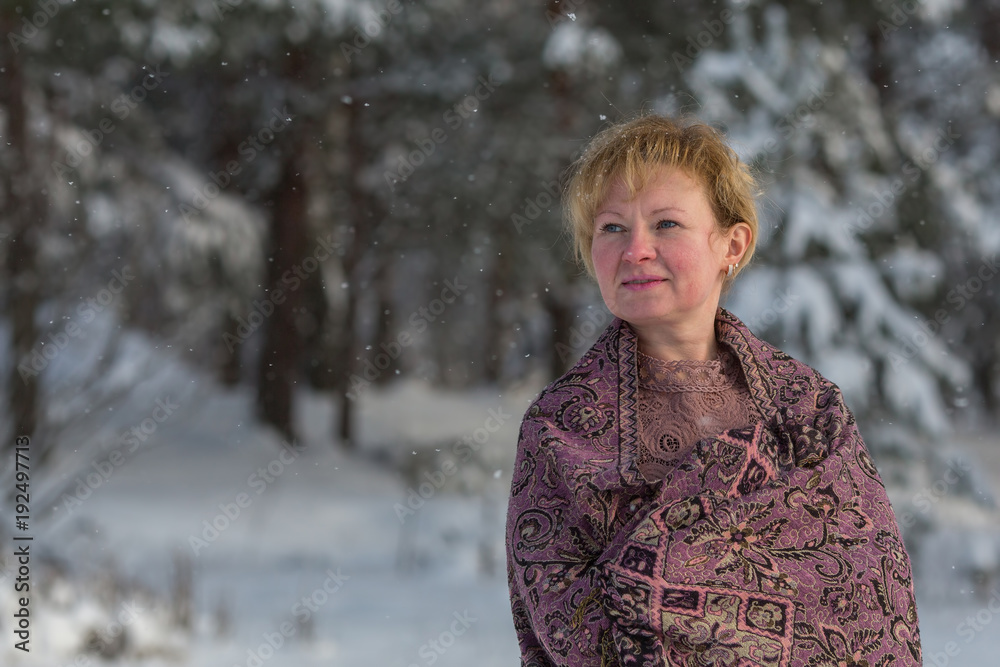 Young russian woman posing in a snowy park in winter. Young russian woman posing in a snowy park in winter.