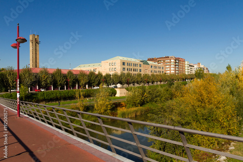 Edificios al lado del rio con pasarela en la ciudad de Leon. España photo