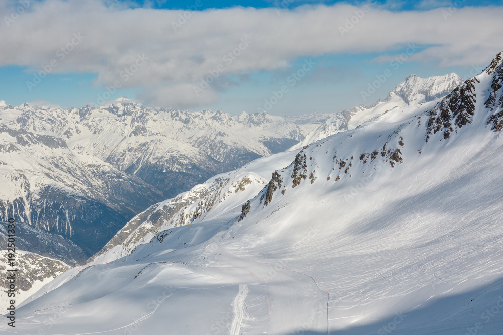 Long piste from Gemsstock peak in SkiArena skiing resort