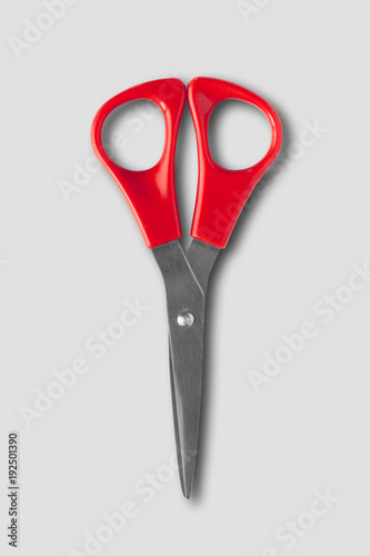 Pair of scissors isolated on grey background