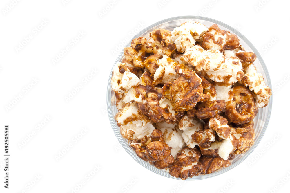 Chocolate popcorn in a transparent glass isolated on white Chocolate popcorn in a transparent glass isolated on white
