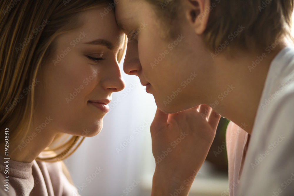 Naklejka premium A smell of love. A lovely young couple is going to kiss