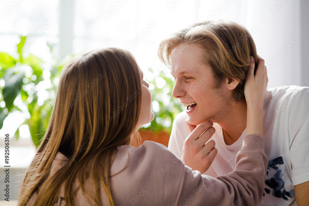 A happy girl is going to kiss her boy. A very sexy moment. A happy girl is going to kiss her boy. A very sexy moment.