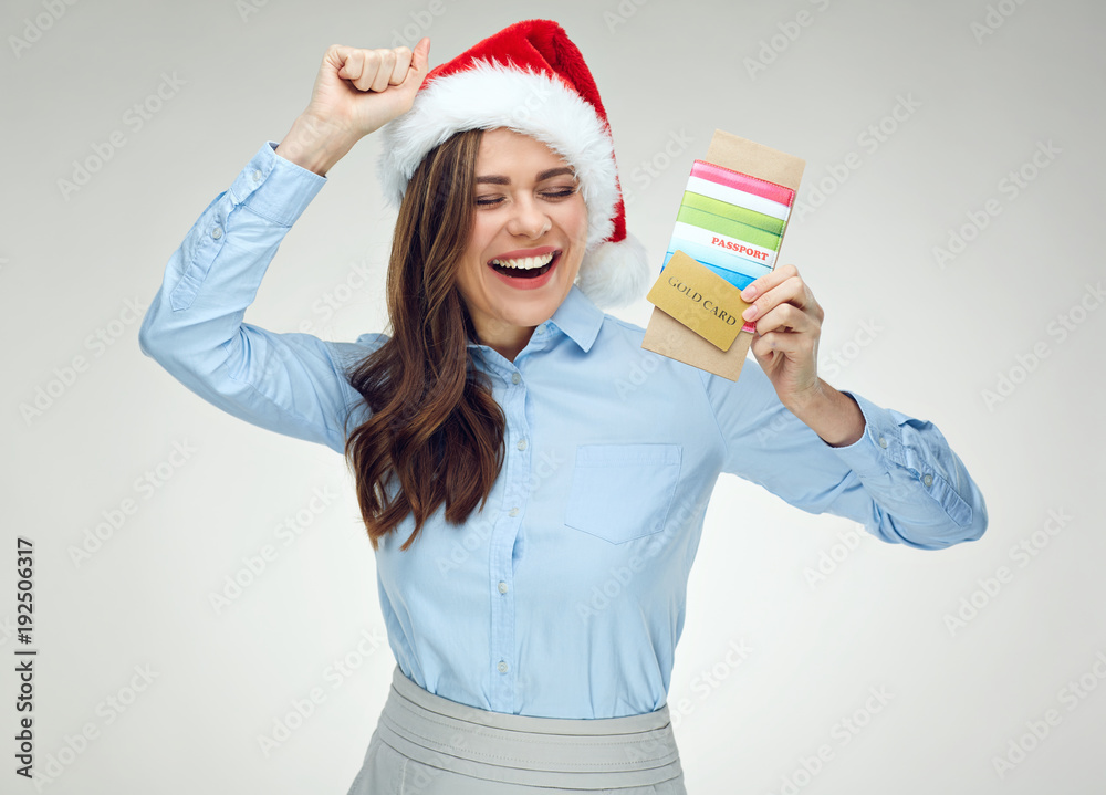 Happy woman holding document, credit card for Christmas travel. Happy woman holding document, credit card for Christmas travel.