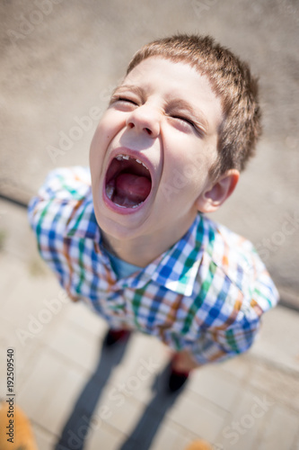 screaming kid with caries and a missing tooth