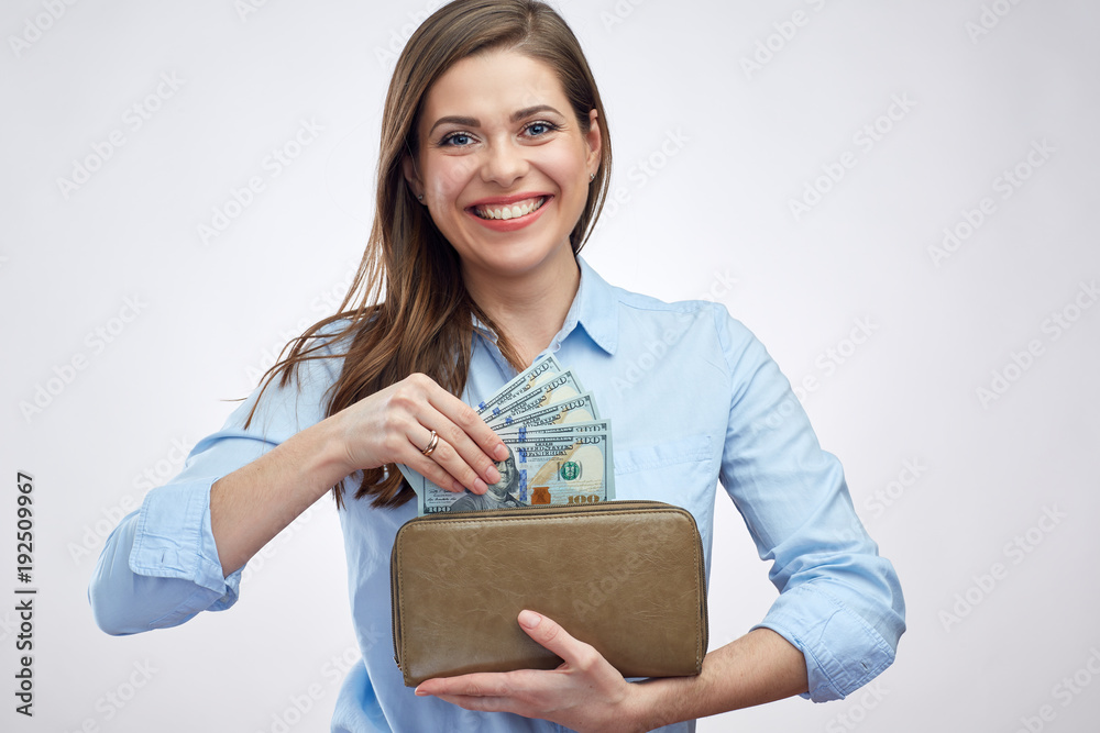 Smiling happy woman holding purse with cash money. Smiling happy woman holding purse with cash money.