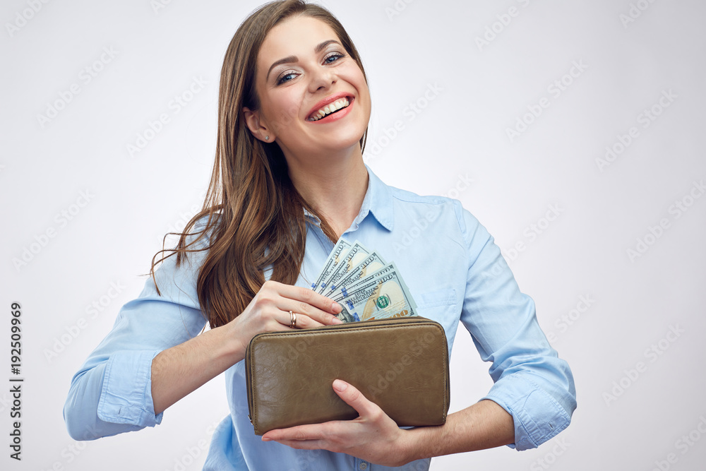 Smiling happy woman holding purse with cash money. Smiling happy woman holding purse with cash money.
