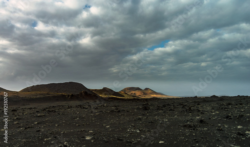 Volcanoes in Timanfaya, Lanzarote. Volcanic landscape and clouds