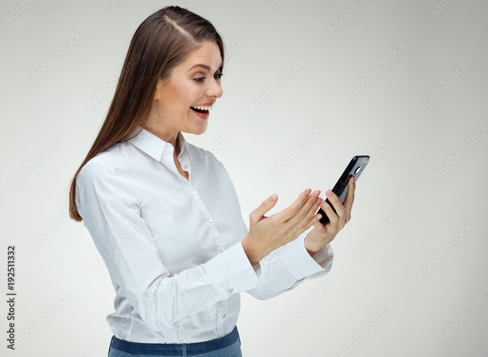 Smiling happy businesswoman using smart phone. Smiling happy businesswoman using smart phone.