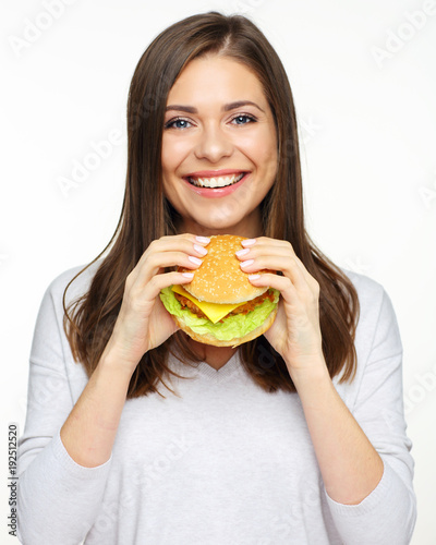 Happy girl holding fast food burger. isolated portrait on white