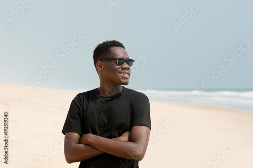 portrait of young man at the beach.