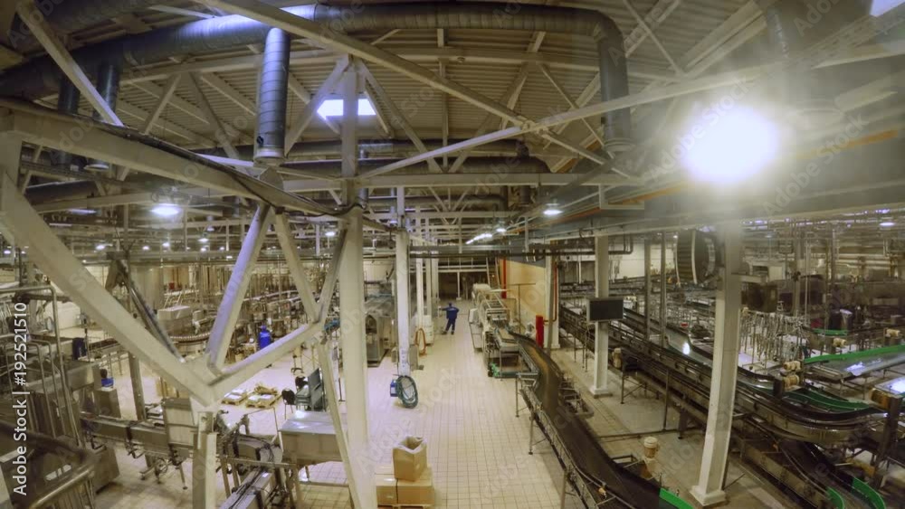 Modern beer factory, brewery concept. Steel tanks and pipes for beer production. Industrial background Modern beer factory, brewery concept. Steel tanks and pipes for beer production. Industrial background