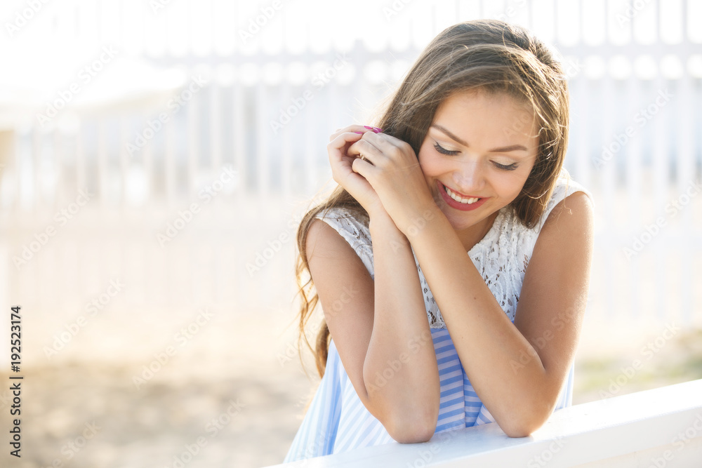 Young smiling woman outdoors portrait. Close portrait.