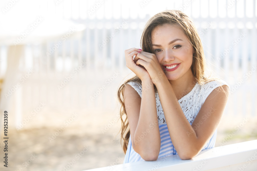 Young smiling woman outdoors portrait. Close portrait. Young smiling woman outdoors portrait. Close portrait.