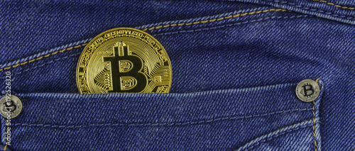 Bitcoin lies in the pocket of blue jeans