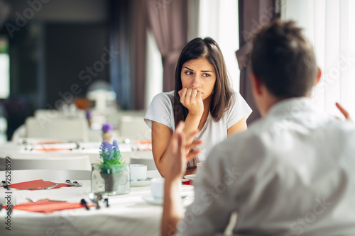 Worried woman doubting,having relationship problems.Making a decision.Wandering,bored,not listening conversation.Not convinced.Not interested.Keeping a secret.Feeling guilty.Regret.Disappointed.