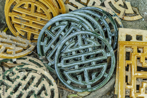 ceramics with the symbol of the longevity in the complex of the mausoleum of the emperor Tu Duc in Hue, Vietnam.