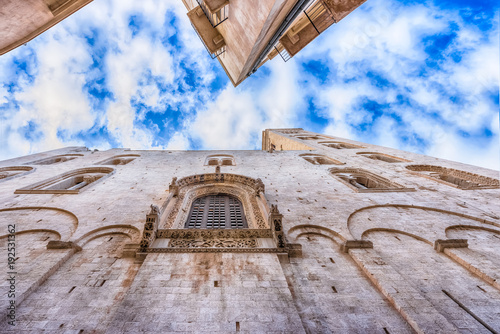 Facades of old town in Bari against blue sky