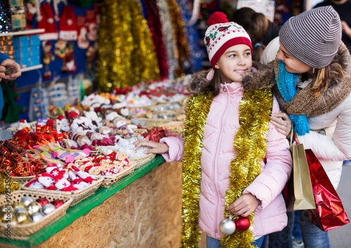 Girl with mom buying decorations