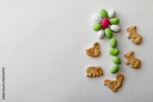 peanuts in colored glaze on white sheet