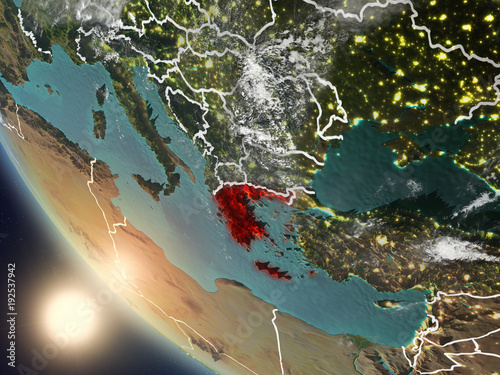 Sunset above Greece from space