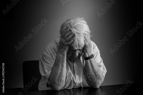Elderly woman distressed, upset and sad