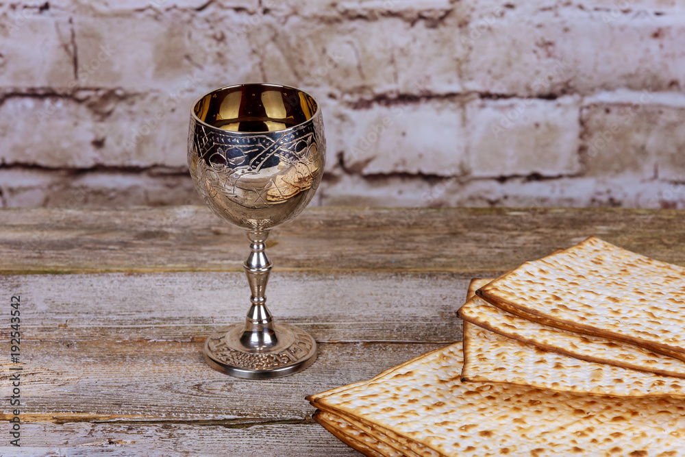 Silver wine cup with matzah, Jewish symbols for the Passover Pesach