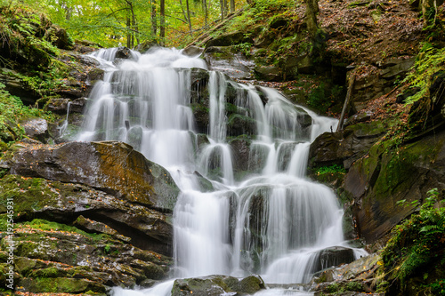 Fototapeta Naklejka Na Ścianę i Meble -  Waterfall Shypit, cascade in Pylypets in the autumn forest. Carpathian Mountains, Zakarpatska oblast, Ukraine.