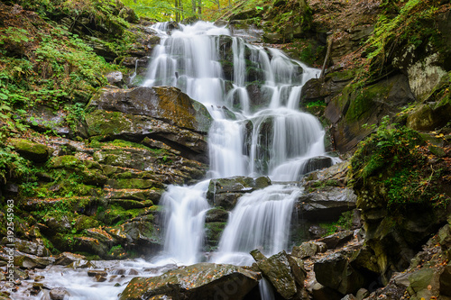 Fototapeta Naklejka Na Ścianę i Meble -  Waterfall Shypit, cascade in Pylypets in the autumn forest. Carpathian Mountains, Zakarpatska oblast, Ukraine.