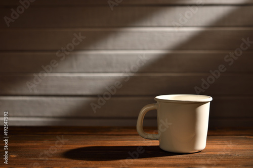 Coffee cup on old wooden background