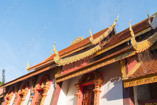 Traditional Asian style Buddhist temple gable ends and roof lines from low point of view