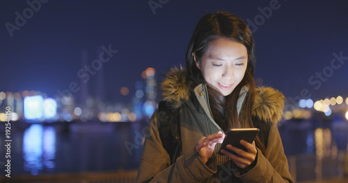 Photography Woman using cellphone in Hong Kong at night
