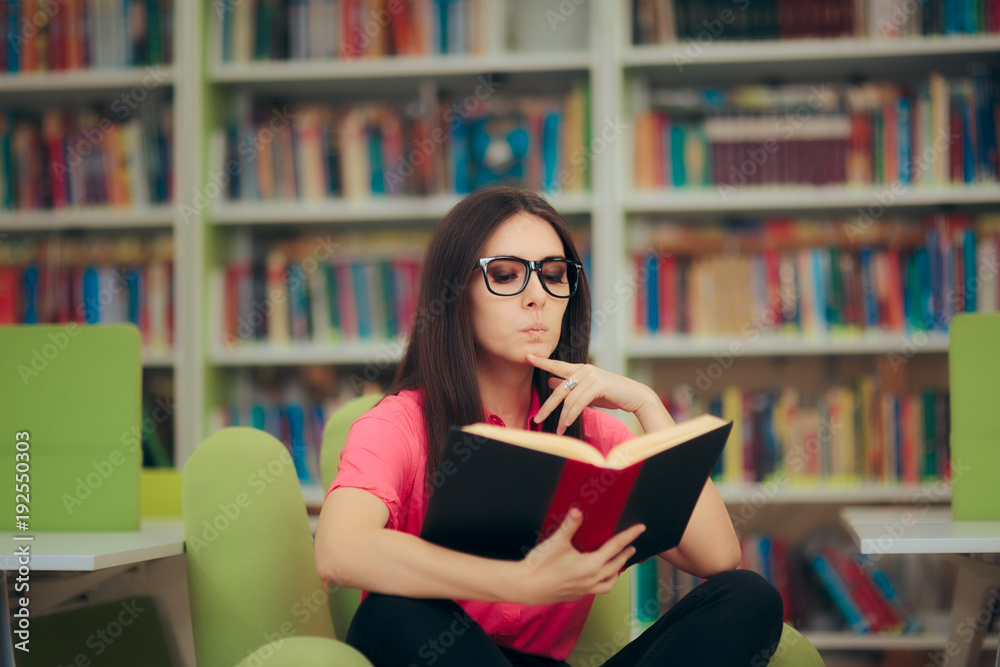 Studious Girl Reading a Book in a Library Studious Girl Reading a Book in a Library