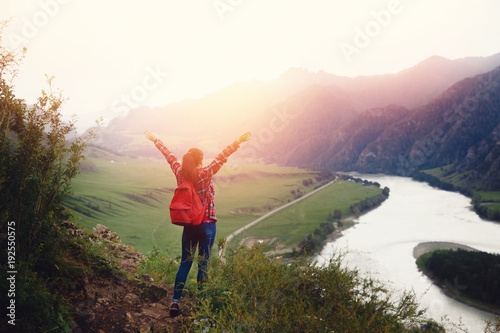 Girl traveler with backpack hiking. Concept travel, lifestyle adventure active summer vacations outdoor rocky background mountains