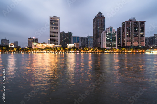 Office buildings and hotel tower reflect in the water of the Pearl river that crosses the Guangzhou downtown district © jakartatravel