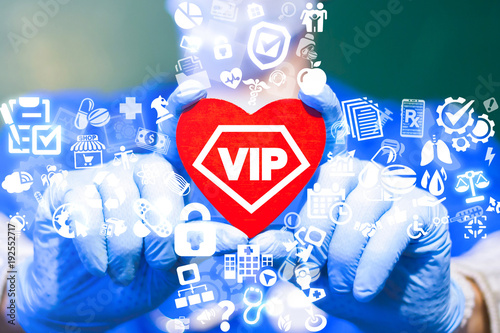 Doctor offers red heart with vip icon on sa virtual interface. VIP Medical Help Patient Care Hospital Service concept. Perfect Excellent Health Care. Premium Invitation Medicine. photo