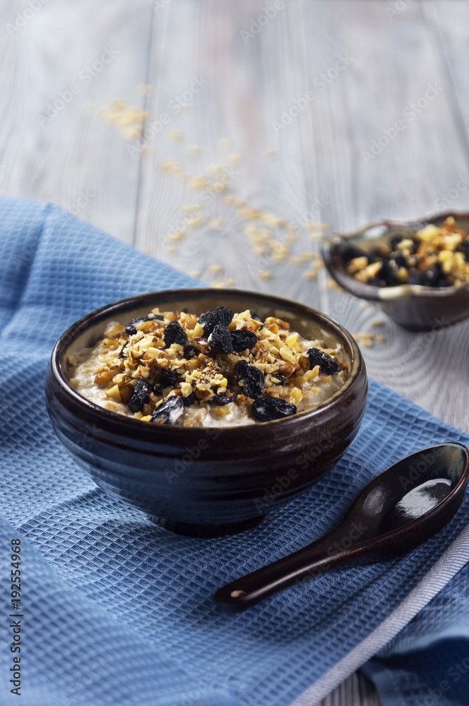 Oatmeal porridge with walnuts and raisins Oatmeal porridge with walnuts and raisins