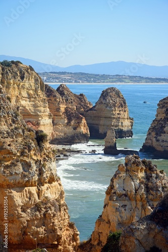 Elevated view of the rugged coastline and cliffs, Ponta da Piedade, Algarve, Portugal. © arenaphotouk