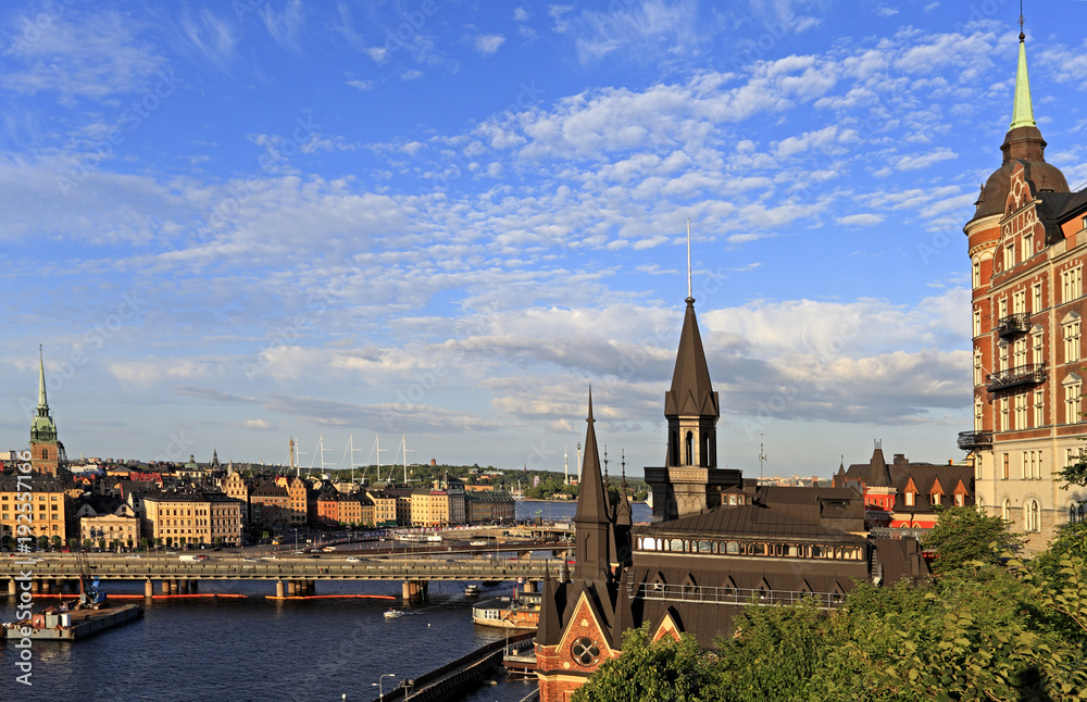 Fototapeta premium Stockholm, Sweden - Old town quarter Gamla Stan with city hall and Centralbron bridge