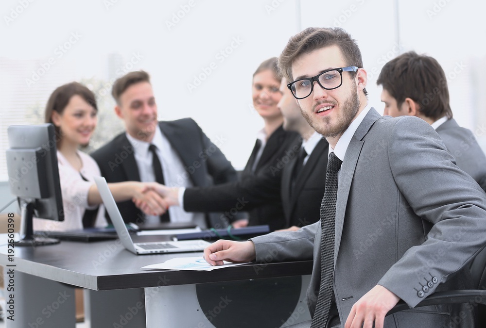 handshake business partners with the Manager in the foreground handshake business partners with the Manager in the foreground