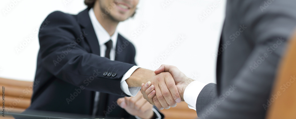 handshake Manager and the client sitting in the office