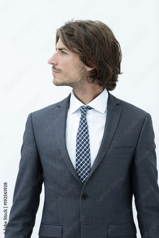 Handsome young business man looking away. Handsome young business man looking away.