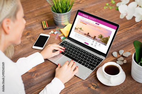 Fotografie Woman looking for travel accomodations