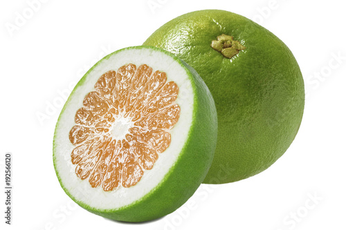 one large whole varietal green grapefruit with a cut half