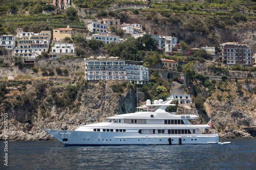 Luxury crewed motor yacht on the Amalfi Coast near Sorrento, Campania. Italy © wjarek