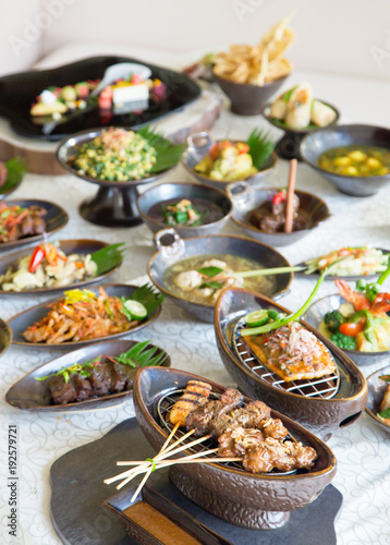 Indonesian cuisine - Many traditional Balinese dishes on the table  top view  