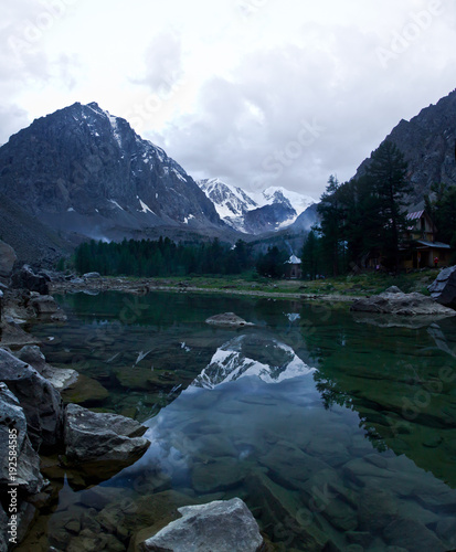 Beautifull valley with view to mountains  trees and lake 