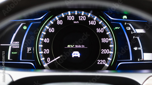 EV- Electrical vehicle mode turned on on hybrid car screen in front of steering wheel for green power fuel transportation technology, environmental eco- friendly, and saving energy concept