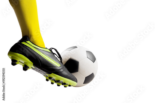 footballer feet kicking soccer ball