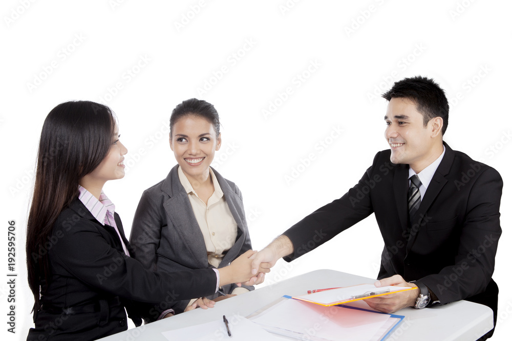 Asian business people handshake in a meeting Asian business people handshake in a meeting
